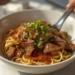 Beef stir-fry with noodles, bell peppers, and broccoli – a flavorful 30-minute Asian-inspired dinner.