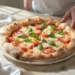 One-pan homemade pizza with melted cheese and toppings, baked in a skillet and ready to serve.
