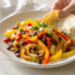 One-pan vegetarian fajitas with bell peppers and onions, colorful and ready to serve.