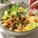 Vegetarian burrito bowl with quinoa and black beans, colorful, fresh, and quick to prepare.