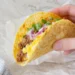 Quick breakfast tacos with scrambled eggs, cheese, and avocado