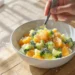 Budget-friendly meal with mixed frozen vegetables and rice, quick and easy low-cost dinner.