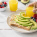 Quick healthy breakfast with high-fiber foods including oatmeal, berries, whole grain toast, and chia seeds