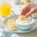 Healthy breakfast for kids with fruit kabobs, pancakes, yogurt parfaits and egg muffins on colorful plate