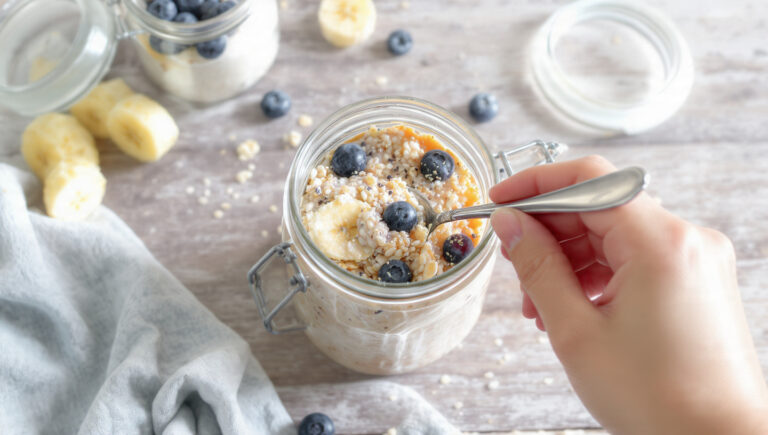 Quick healthy overnight oats with berries and banana in glass jar