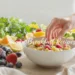 Quick vegan breakfast recipes with oats, avocado toast, smoothie bowl, chia pudding and pancakes on wooden table