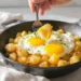 Healthy breakfast made from leftovers — repurposed rice, veggies, and eggs on a morning plate.