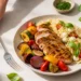 Bright overhead food photo of a cheap summer dinner under $15 with fresh herbs on a neutral linen surface.