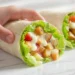 Chicken Caesar wrap recipe with grilled chicken, romaine lettuce, parmesan, and Caesar dressing in a flour tortilla