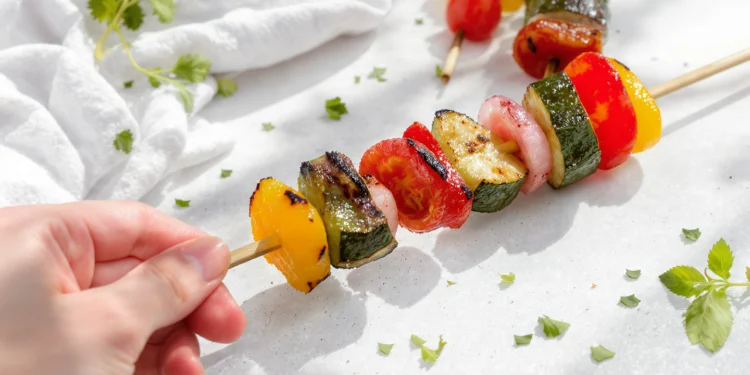 Grilled veggie kabobs with bell peppers, zucchini, and mushrooms on skewers — easy summer vegetable recipe