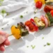 Grilled veggie kabobs with bell peppers, zucchini, and mushrooms on skewers — easy summer vegetable recipe
