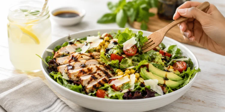 Quick summer salad with fresh greens, tomatoes, and cucumber for a light healthy dinner