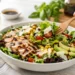 Quick summer salad with fresh greens, tomatoes, and cucumber for a light healthy dinner
