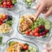 Summer meal prep containers with fresh vegetables, grains, and proteins for busy families — healthy weekly prep