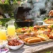 Summer cookout menu with grilled meats, fresh salads, corn on the cob, and refreshing side dishes