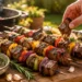 Grilled steak kabobs with peppers and onions, juicy and charred for a flavorful BBQ recipe.