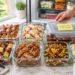 Summer BBQ meal prep ideas featuring grilled chicken skewers, sweet corn, and veggies in glass containers.